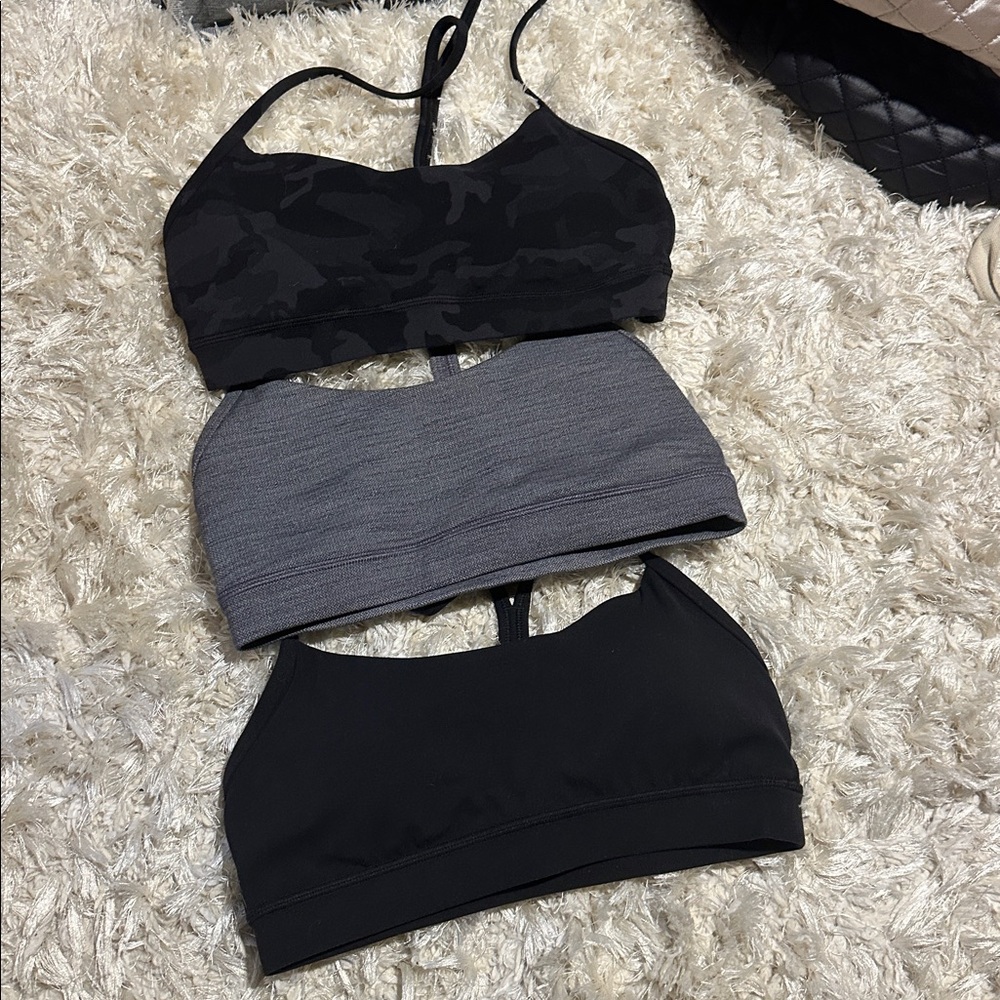 Set of four Lululemon Sports Bras - Black, Gray, and Camouflage